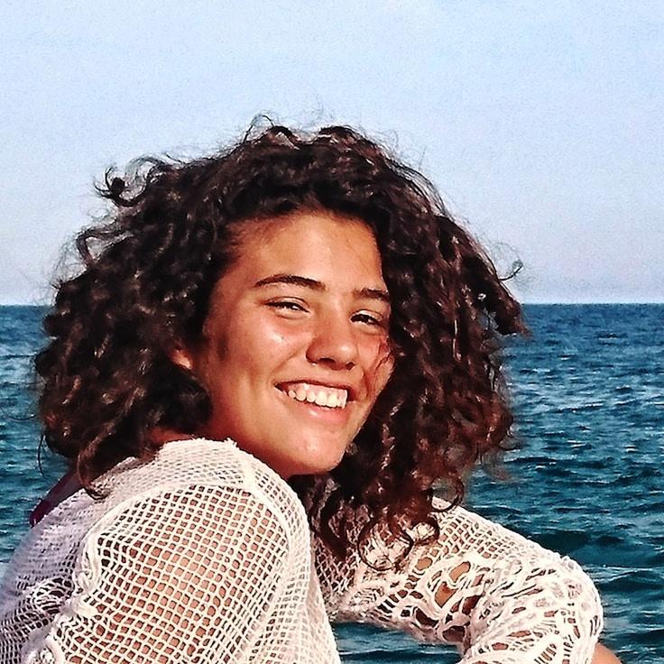 Alex Rivera, Lead Design Curator at Infinite Explore World, reviewing corporate floral arrangements